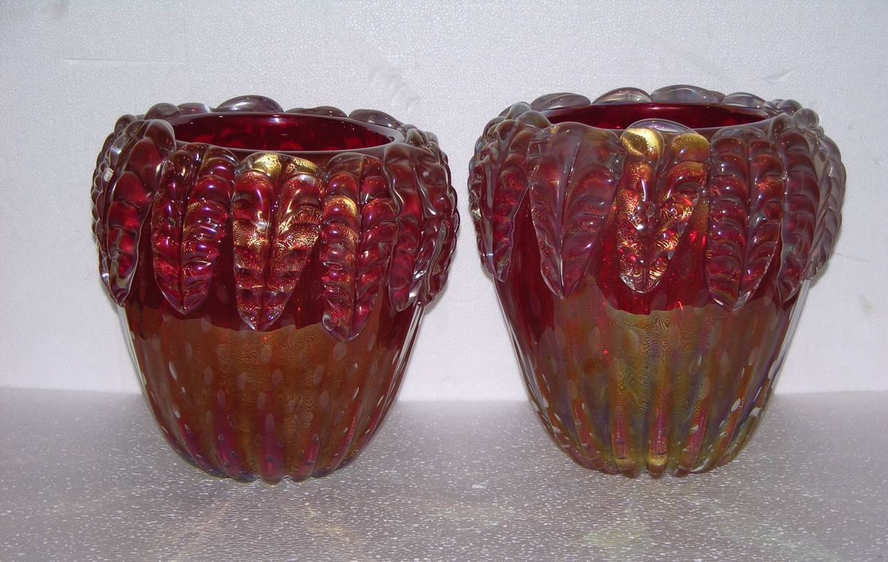 1970s stunning Italian pair of rare Murano glass vases signed by Cenedese, the blown Murano glass is in a very rare plum color and worked with pure gold. They are preciously accented by iridescence that makes them glow in different shades of color.