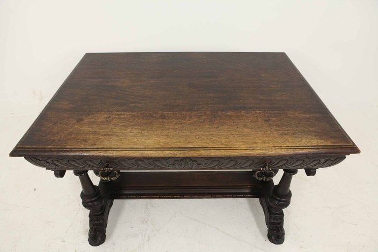 Very nice Victorian carved oak library table with detailed carving around all sides, carved lions masks, canted corners, single carved oak drawer, carved arches sitting on a heavily carved base.

Shipping will be $295 by Greyhound.

