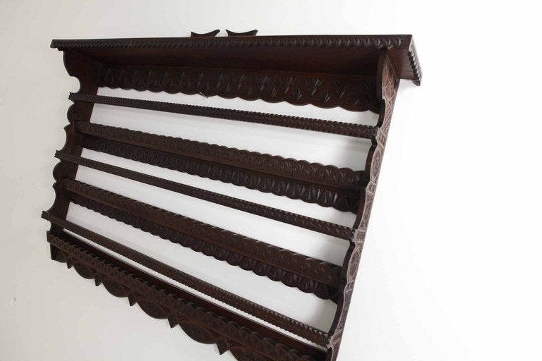 Large antique chip carved walnut plate rack wall shelf with carved back over three (3) plate racks, all in original condition.

Shipping will be $110.00 by Greyhound.

