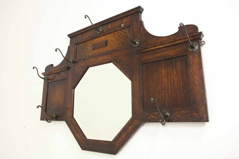 Oak mirror back wall mounted hat and coat rack with original coat hooks and bevelled mirror.

Shipping will be $85.00 by Greyhound.
