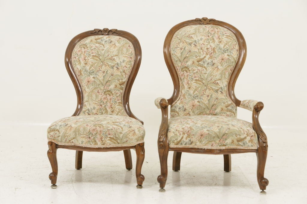 Quality pair of mahogany ladies and gents Victorian parlour chairs with cabriole legs upholstered in a tapestry fabric.  All joints are tight.<br />
Gents: 24