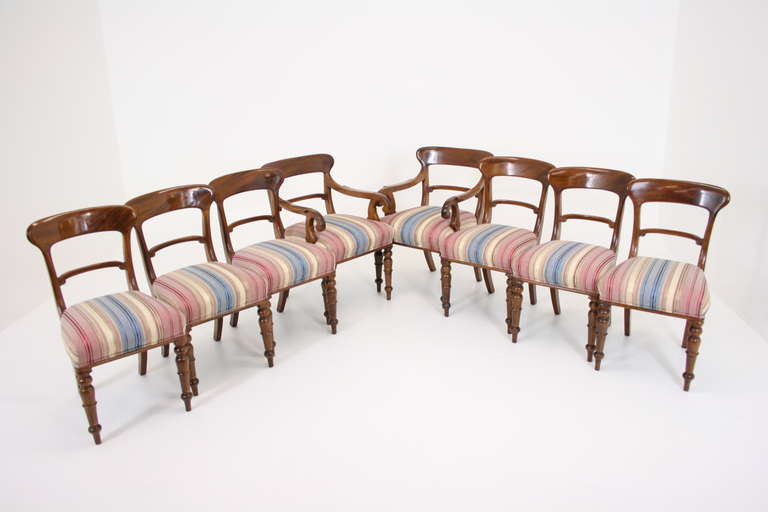 Nice quality set of eight 19th Century Victorian bar back mahogany dining chairs standing on turned and tapered shaped legs.  The chairs have a shaped top rail and horizontal centre splats above upholstered seats.  Carver chair arms are 26