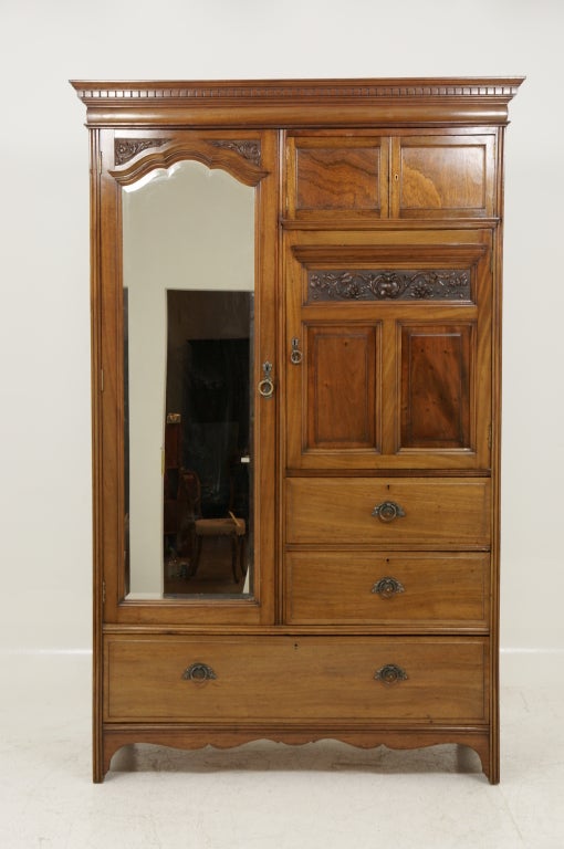 Quality Victorian walnut wardrobe, four (4) drawers to right with two (2) door cupboard above.  Hand cut dovetails to all drawers.  Bevelled mirror to left with ample hanging spaces within.  Please note photo showing damage to bottom left back.