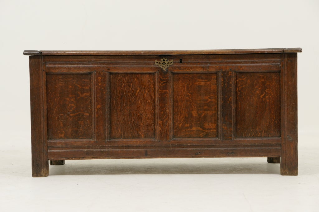 Excellent Scottish oak 18th century coffer with hinged top, panelled on all sides with moulded frame, carved intials (RS), sitting on block legs.  Great patina and color.  Lock is not operational.