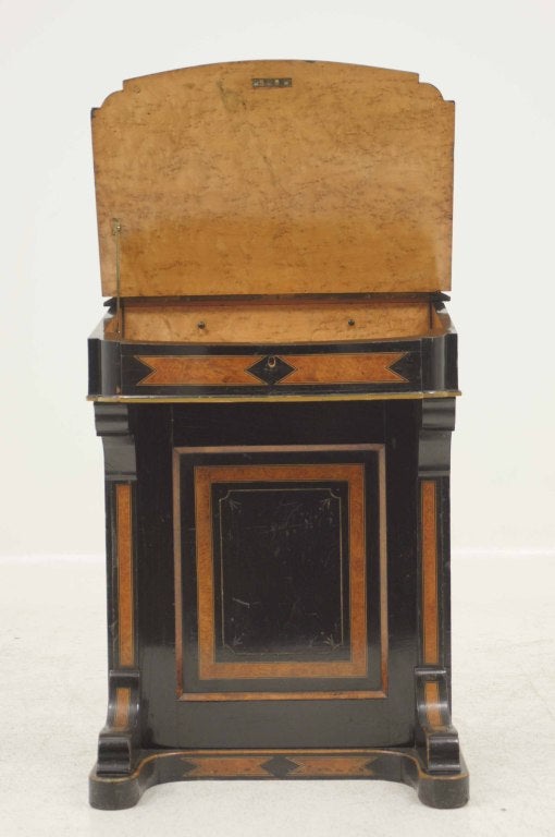 Victorian ebonized burled walnut Davenport desk with hinged moulded lid, slight bow hinged writing slope with tooled leather and birds eye maple drawers below writing slope, four (4) gable drawers on right side and opposing dummy drawers.