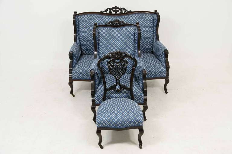 Reupholstered three (3) piece late Victorian parlor suite consisting of a two seat settee (52