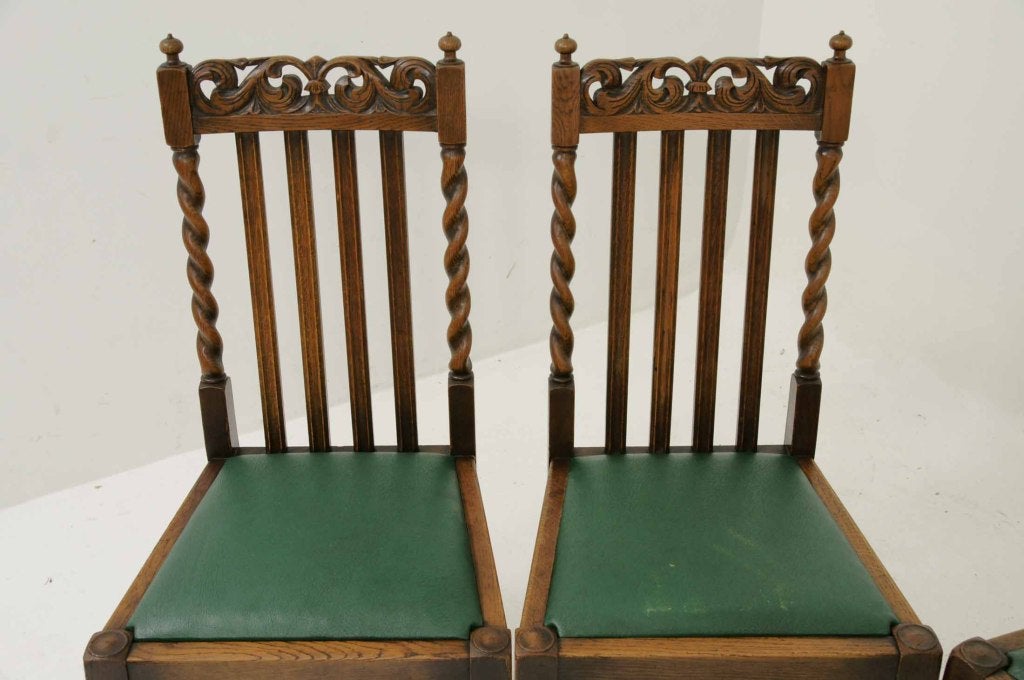 Set of six (6) oak barley twist dining chairs, the pierced foliate carved top rail over vertical splats flanked by barley twist turned supports, drop in seats raised on block and turned legs with stretchers.
