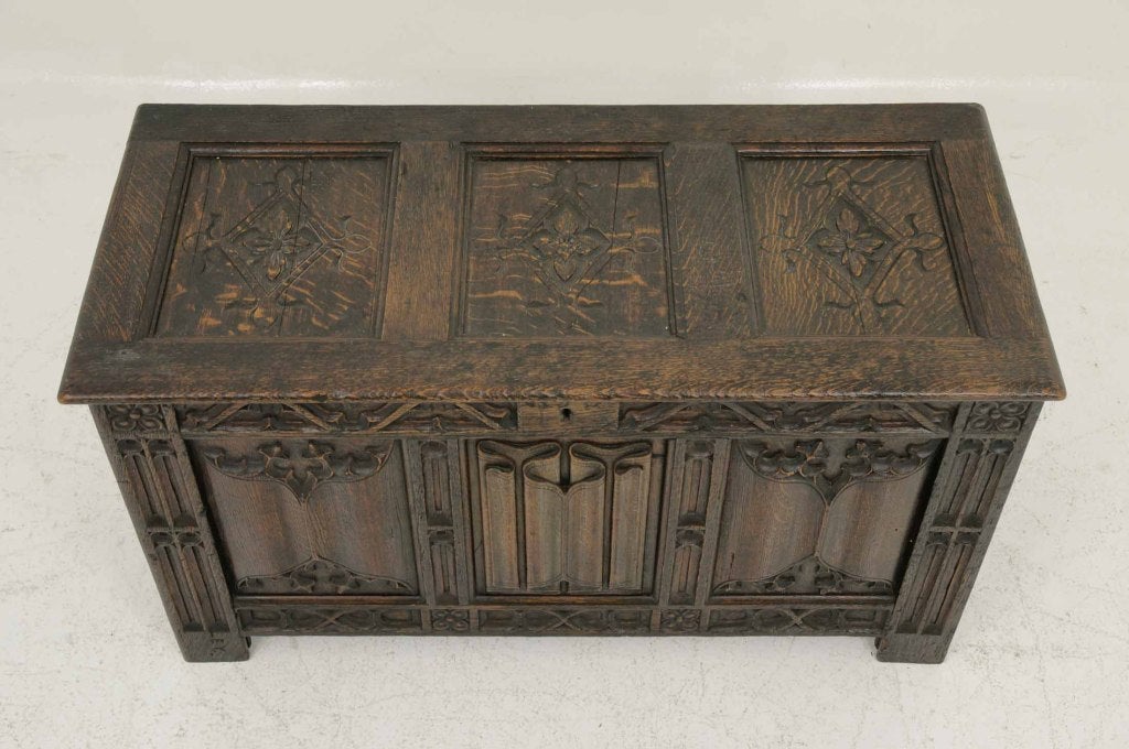 Very heavily carved Victorian oak coffer, the carved moulded rectangular hinged top above three (3) panels with linen fold carving, raised on block feet.

Shipping will be $185.00 by Greyhound.