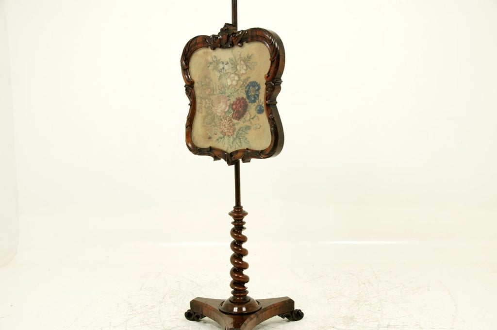 Exquisite Victorian rosewood pole screen with adjustable carved framed shield, enclosing an embroidered floral picture, sitting on a barley twist pole and ending on a carved tripod base. Wonderful warm patina.
 
Shipping will be $185 by Greyhound.