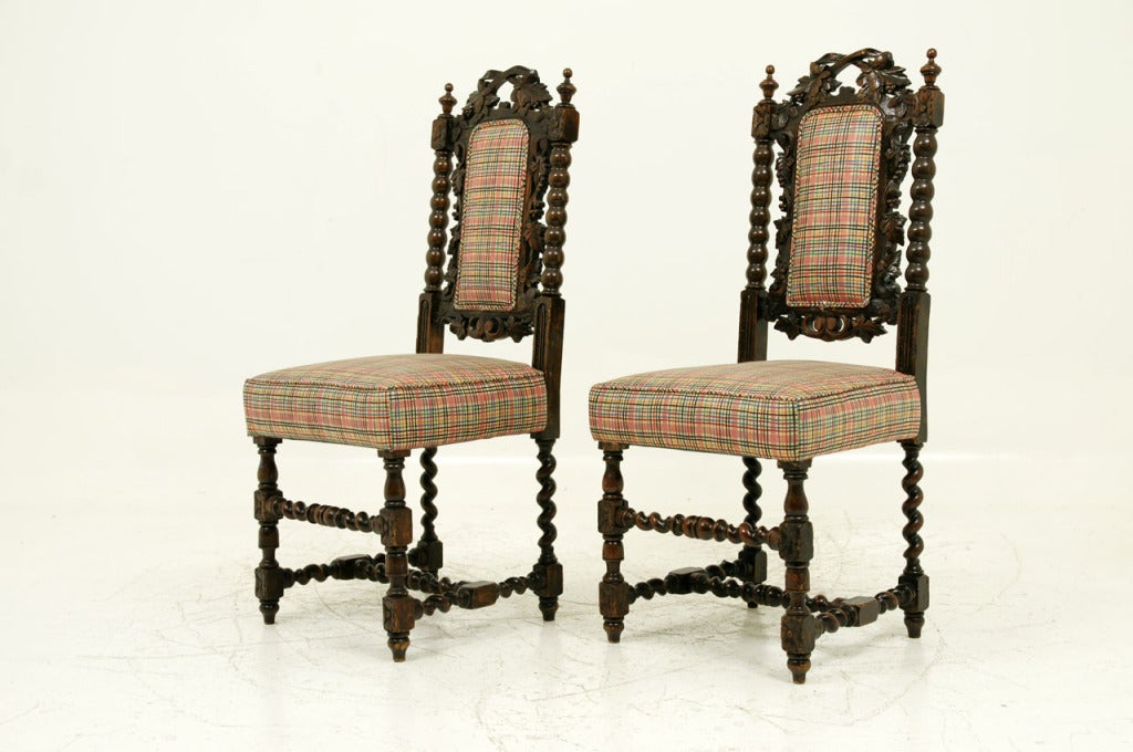 Pair of Victorian carved oak barley twist chairs with bobbin uprights on upholstered seat ending on barley twist legs.
 
Shipping will be $110 by Greyhound.