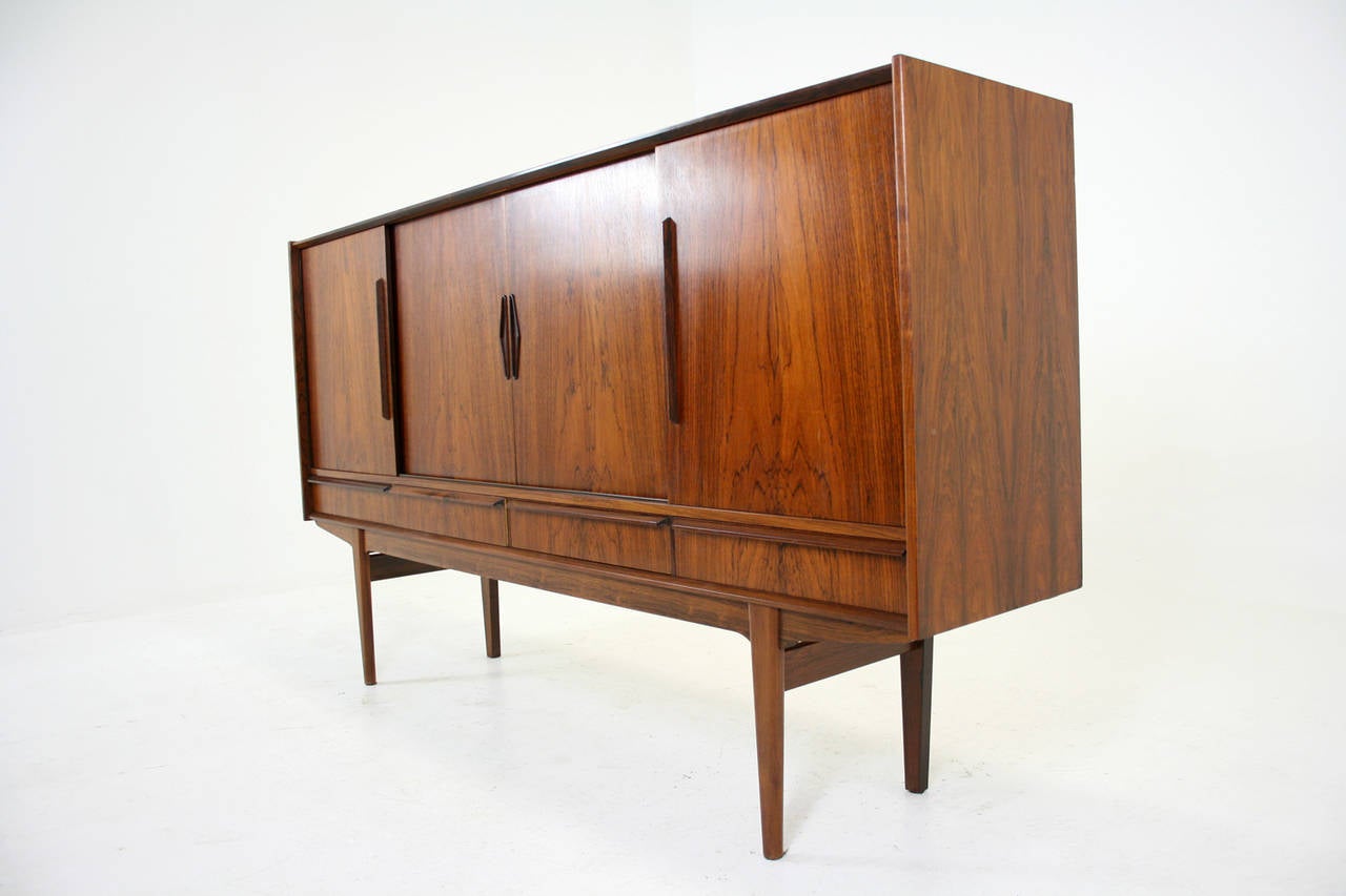 -$2995
-Danish, 1960’s
-Solid rosewood & rosewood veneer construction
-High quality, unique piece
-Original finish is in excellent condition
-Bar cabinet on left hand side
-Doors and drawers slide well
-79″W x 17″D x 45″H
-Shipping $550 by