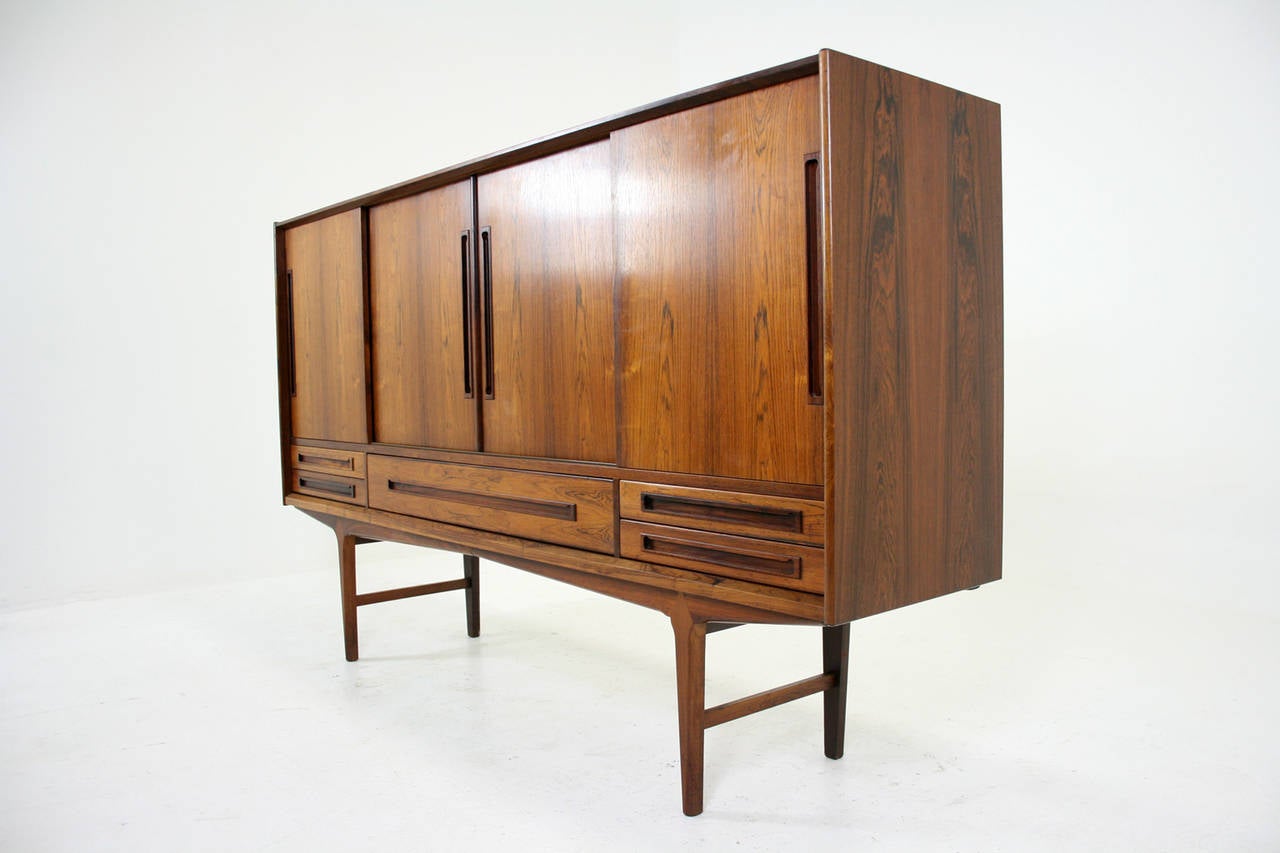 -$2795
-Danish, 1960’s
-Solid rosewood & rosewood veneer construction
-High quality, unique piece
-Original finish is in excellent condition
-Bar cabinet on left hand side
-Doors and drawers slide well
-79″W x 18″D x 48″H
-Shipping $550 by