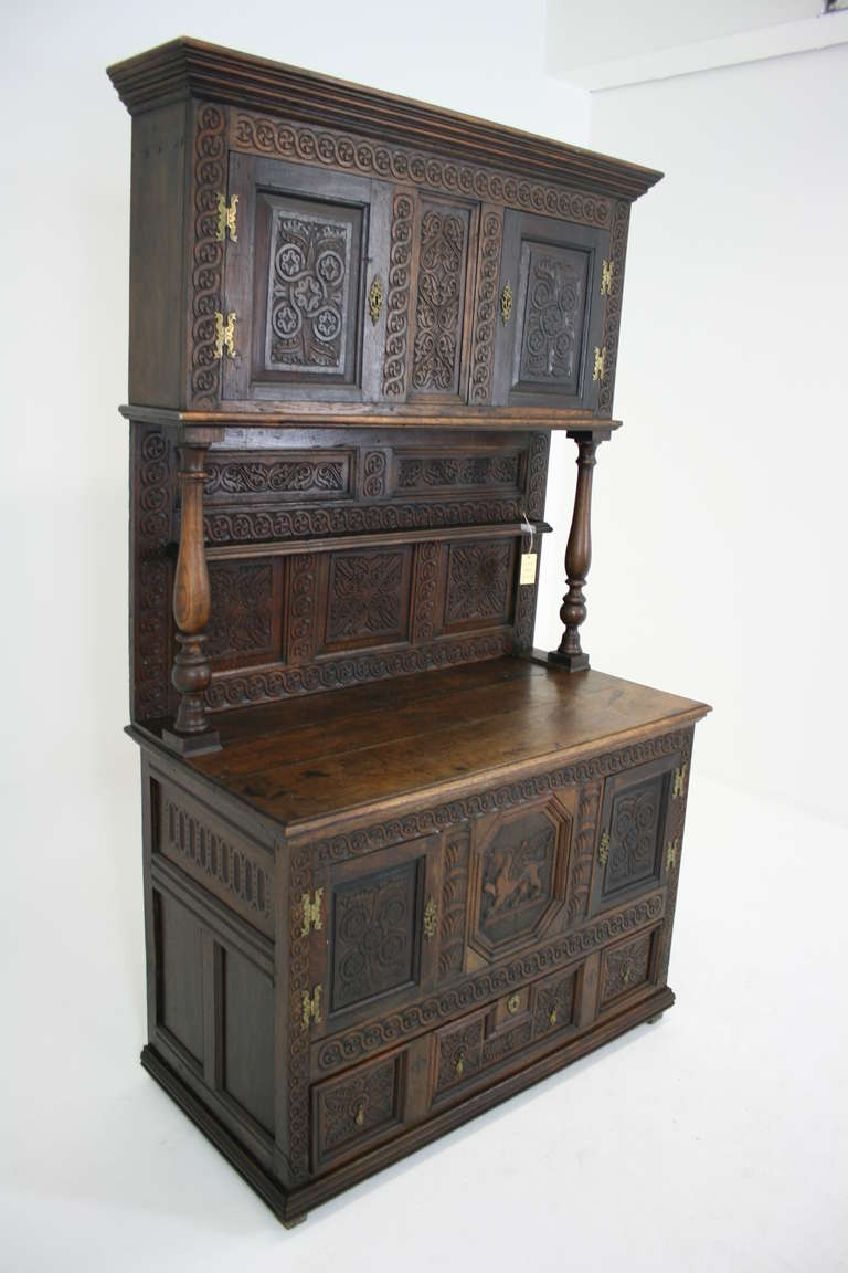 Scotland, 1710, original dark oak finish, solid oak. All hand-carved. Separates into two pieces. Very heavy. Brass hardware. (C2210) <br />
Bottom: 50