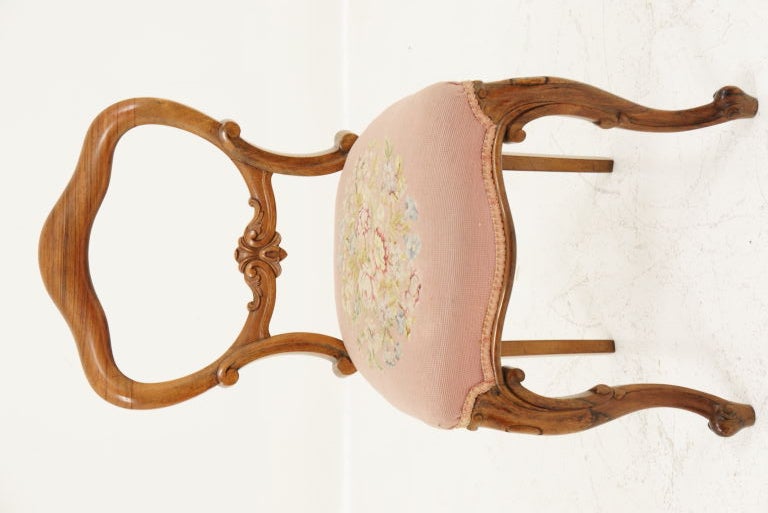 A lovely solid rosewood balloon back chair with floral needlepoint upholstery.<br />
<br />
************** Important Customs Information ******************<br />
<br />
Please note, USA buyers of any item(s) that exceeds $2000 USD in total value