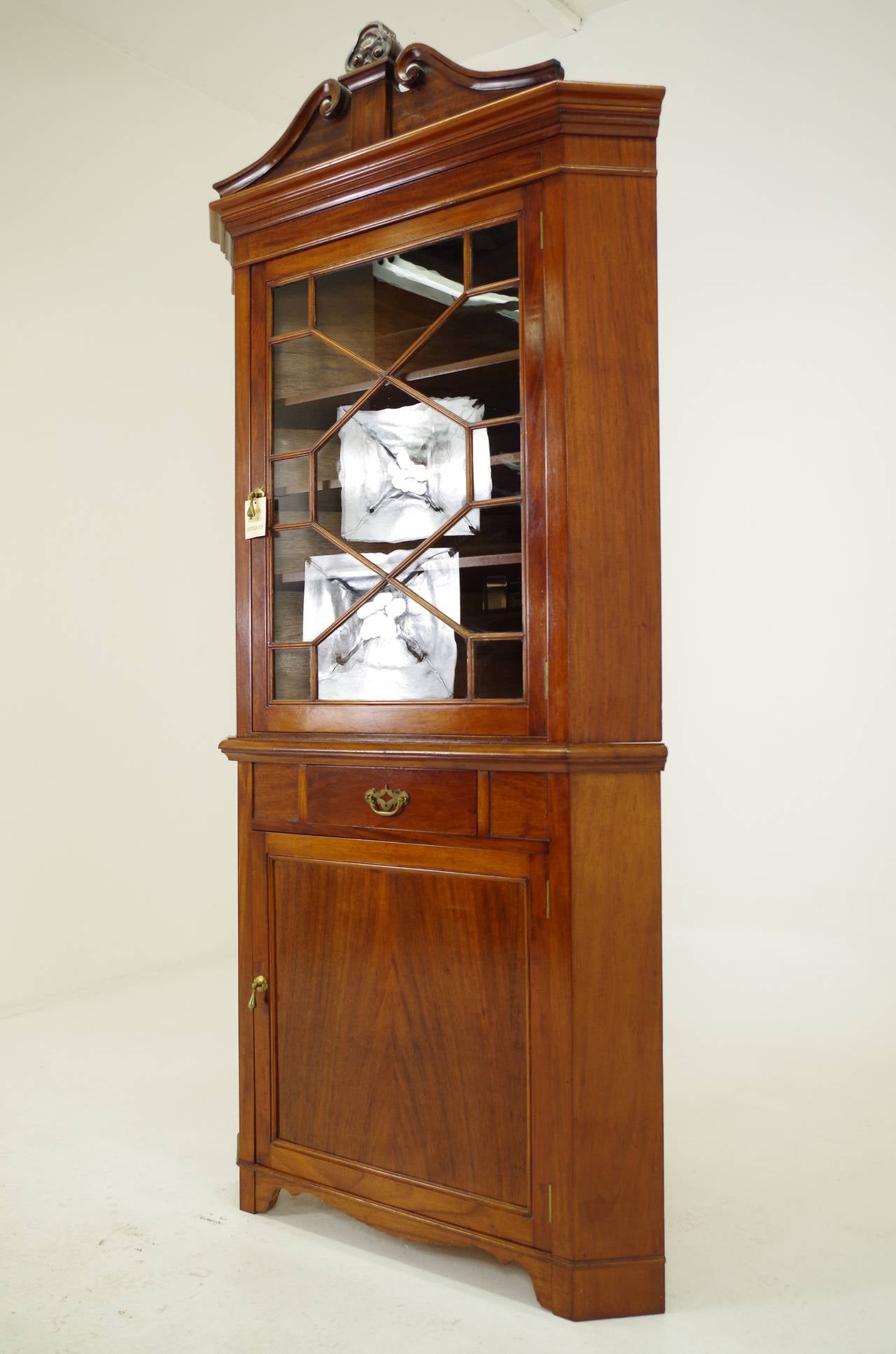 - $1650.00
 - American, 1910
 - Solid mahogany, original finish, original glass
 - Single glass door above eclosed with 3 shelves
- Central drawer with brass handle
 - Solid panelled door below, enclosed with 2 shelves
 - 43″w x 19″d x 89.5″h,