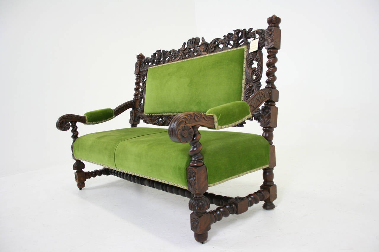 - $2450
- Scotland, 1870
- Solid walnut construction
 - Very thick barley twist supports
- Heavily carved open pierced back
- Down swept carved arm rests
- Green velvet seat and back (not original)
 - All joints are tight
- 60″w x 33″d x