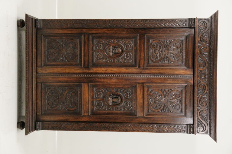 This armoire has two heavily carved doors with six panels on each door.  Heavily carved cornice and carved columns.  The finish is a dark oak stain and the armoire is all original and is in excellent condition.<br />
<br />
**************