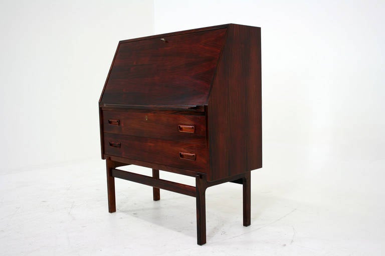 -$1795.
-37.5″ W x 17.5″ D x 43.5″ H.
-1960s Danish, rosewood.
-Slide out support for drop down writing door.
-Lots of storage and display options.
-Interior fitted with two drawers and compartments.
-Office desk, dresser and display