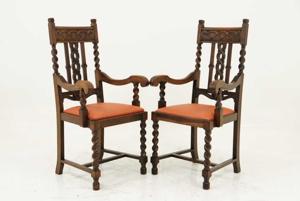 A very fine pair of oak barley twist fireside arm chairs.  Barley twist on both the upper and lower portions of the chair.  Seats are removable for recovering. <br />
<br />
<br />
************** Important Customs Information