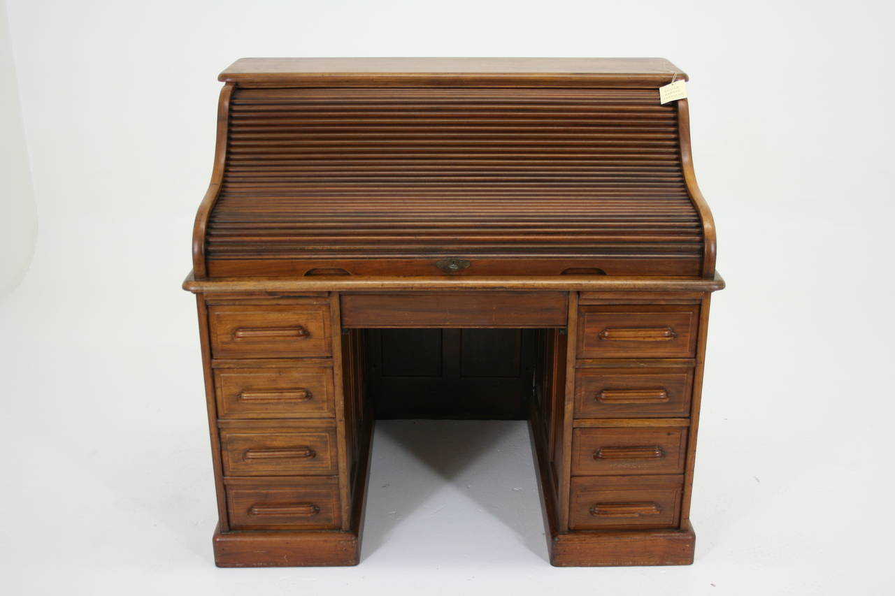- $1250.
 - American, 1910.
 - Solid mahogany. 
 - Double pedestal. 
 - Panelled sides and back. 
 - Dovetailed drawers.
 - Roll top in good working order.
 - Original lock and key.
 - Original finish. 
 - 48