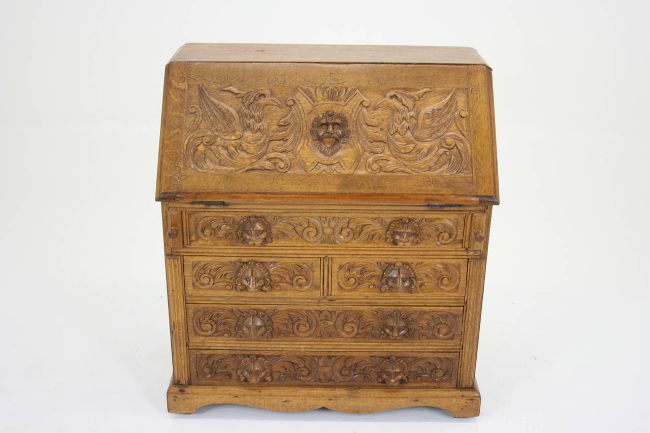 - $1850.
 - Scotland, 1880.
 - Heavily carved front.
 - Fitted interior.
 - Two short drawers with carved handles.
 - Three long drawers with carved handles.
 - Pull-out supports.
 - Bracket feet.
 - Very heavy. 
 - Measures: 36