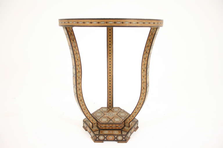 A inlaid Syrian circular side, end table with tripod base supported on a hexagonal base.