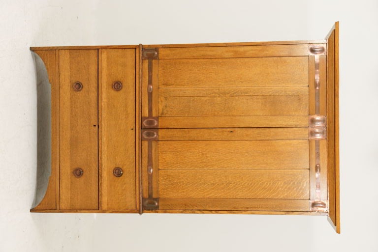 Handsome Scottish oak linen press with cupboard above and four drawers below with original copper hinges and dovetailed drawers. Very clean condition.<br />
<br />
************** Important Customs Information ******************<br />
<br