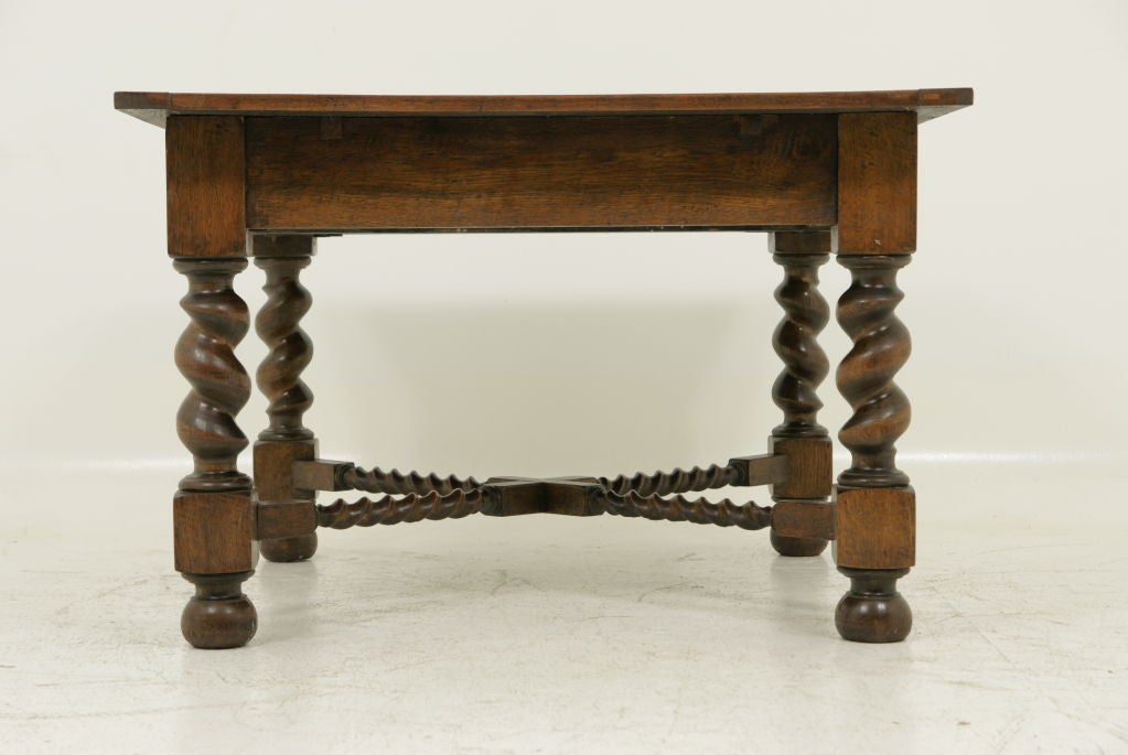 Very large oak table with wide diameter barley twist legs, solid oak, thick plank with carved oak barley twist stretcher.  Table top has been refinished.<br />
<br />
************** Important Customs Information ******************<br />
<br