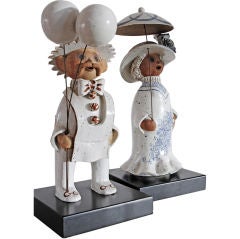 Stoneware Sculpture, balloon man and woman with parasol