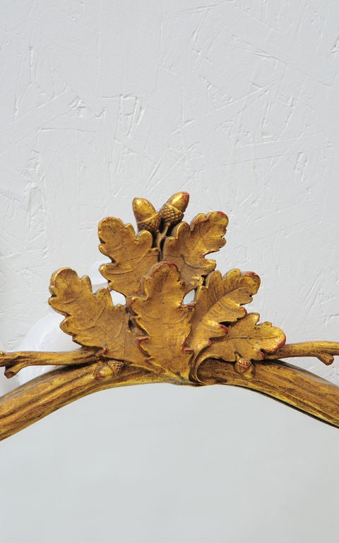 Carved and gold leafed mirror. With oak leaf and acorn motif.Great looking mirror.