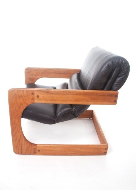 Great pair of cantilevered/sling leather chairs by Lou Hodges.  These chairs look fantastic from all angles.