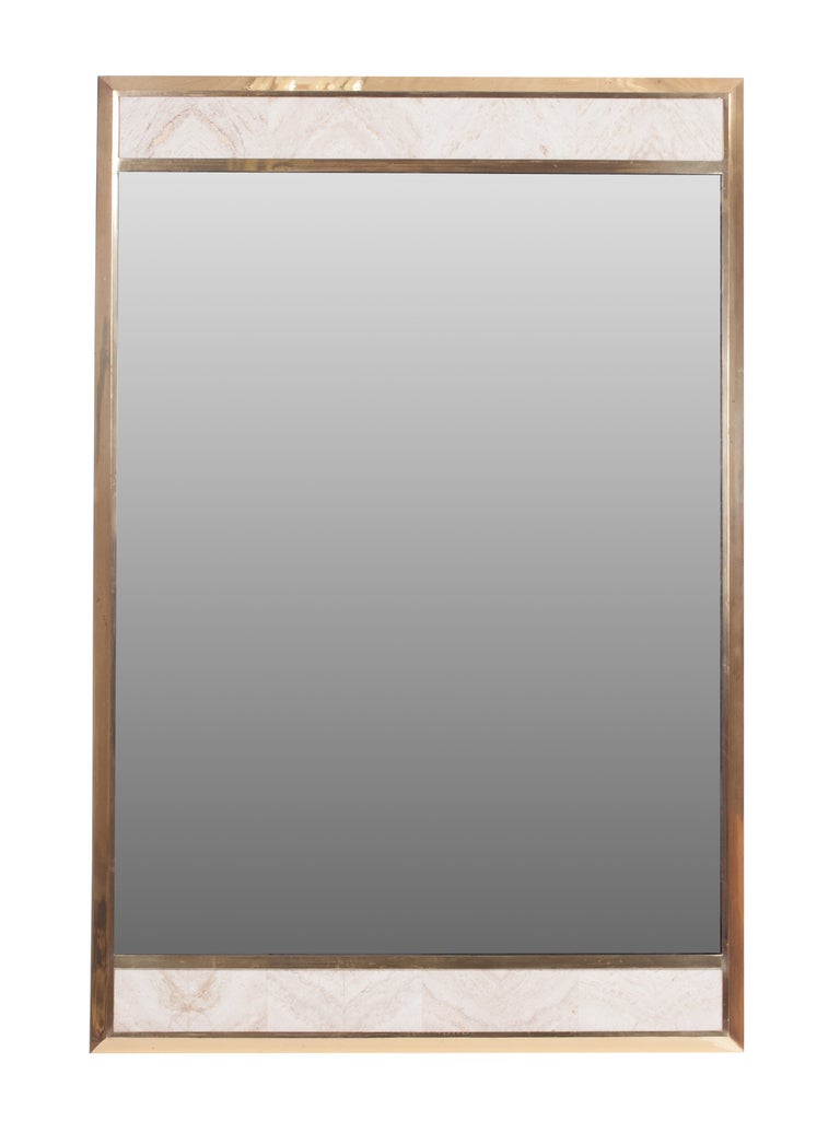 Rectangular brass framed mirror inset with travertine panels, circa 1980s Italy.