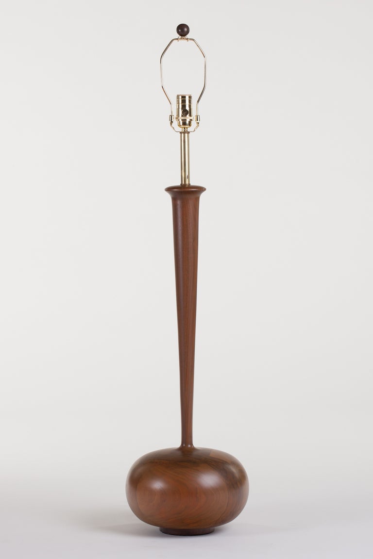 Monumental handcrafted walnut and oak lamp with long tapered stem, after Phillip Powell, circa 1960s.