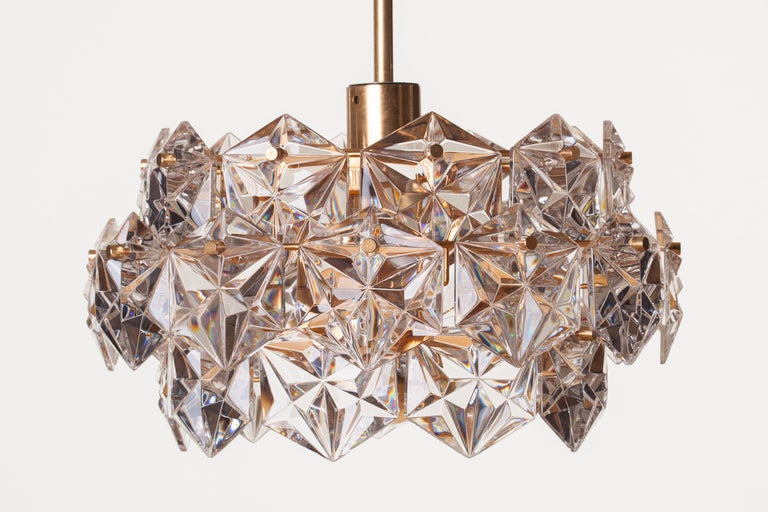 Faceted hexagonal crystal three-tier chandelier on gilt frame. Labeled, Kinkeldey.
