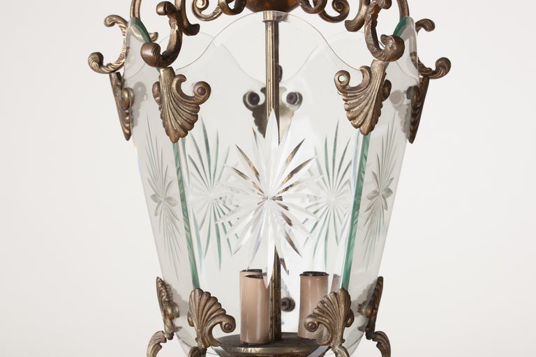 Ornate brass lantern chandelier with five etched starburst glass panels, .
One brass screw missing. Italy, c. 1950's-60's