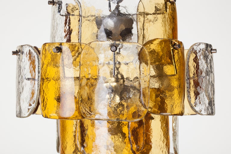 Mazzega clear and amber hand blown Murano glass curved petals chandelier 
on four tier chrome frame, Italy, 1970s.