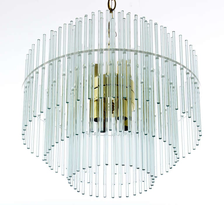Five-tier circular chandelier of fine glass rods on brass frame by Gaetano Sciolari. Circular brass ceiling cap and chain. Six sockets with 40 max wattage per socket, Italy, 1980s.
