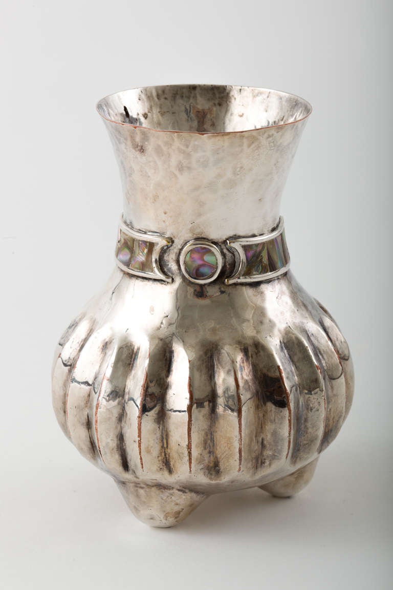 Beautiful hand-wrought silver plated copper melon shape vase with abalone inlay detail. Signed, Los Castillo, Taxco, Mexico.