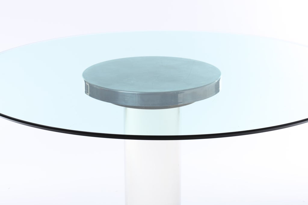 Italian lucite, brass and aluminum pedestal table with glass top, circa 1970s.
Created by artist Romeo Rega. Base diameter measures 24