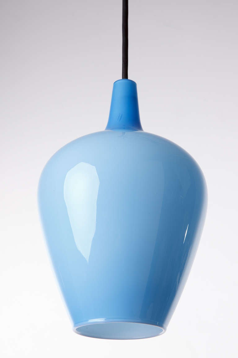 Celestial blue cased glass pendant fixture, circa 1960s. Measurement given is for glass body. Original rubber ceiling cord may be adjusted for height.