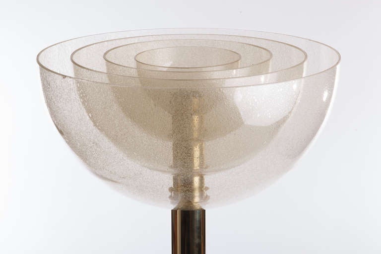 Pair of Mazzega brass floor lamp with four concentric handblown glass shades, Light radiates and is softly diffused through the glass shades. Italy, circa 1970.