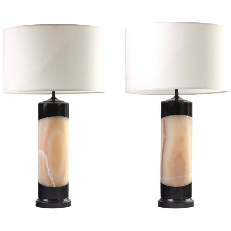 Hand-carved onyx and obsidian stone lamps are internally illuminated with separate lamp switch. Bronze-plated solid brass hardware, double socketed.