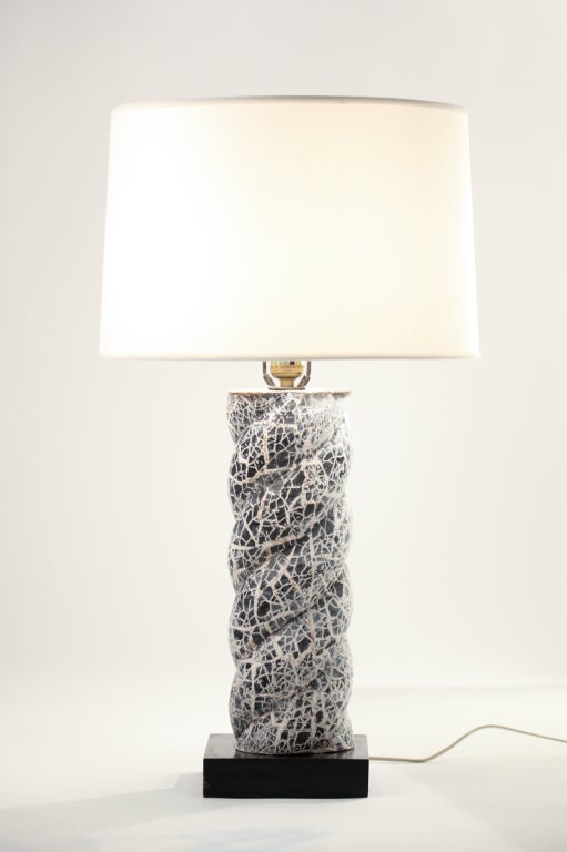 Pair of 1950s ceramic mosaic and plaster twisted column lamps, with ebonized wood bases. Hardware has been recently been replaced with nickel plated solid brass hardware. Images shown were photographed prior to replacement.