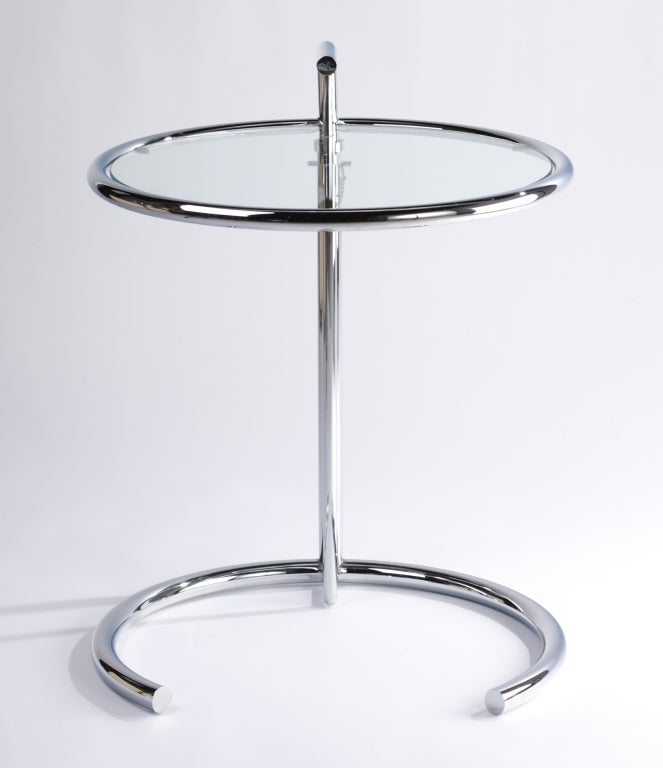 Eileen Gray designed E-1027 chromium plated steel tube table with circular glass top. Height is adjustable. Designed for her home E-1027 