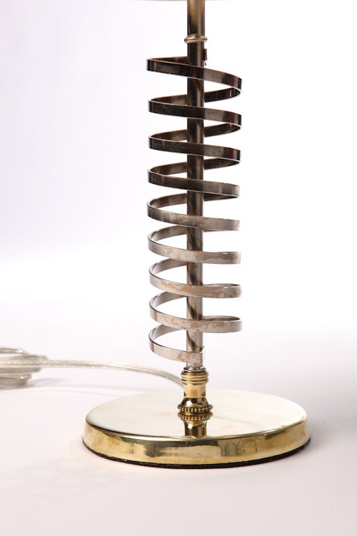 Pair of nickel spiral lamps with brass circular bases. 