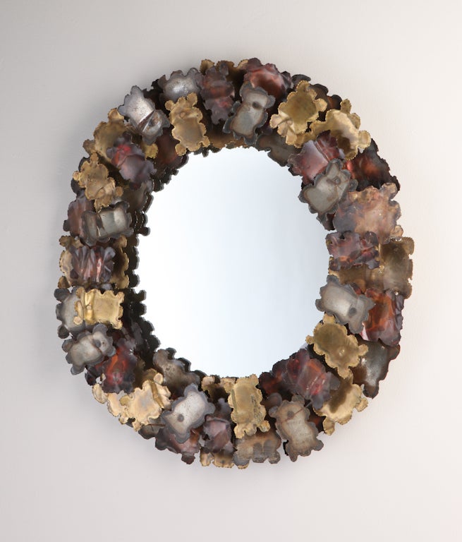 Torch cut and patinated steel, brass and copper abstract flower sculpture mirror, circa 1970s, USA
