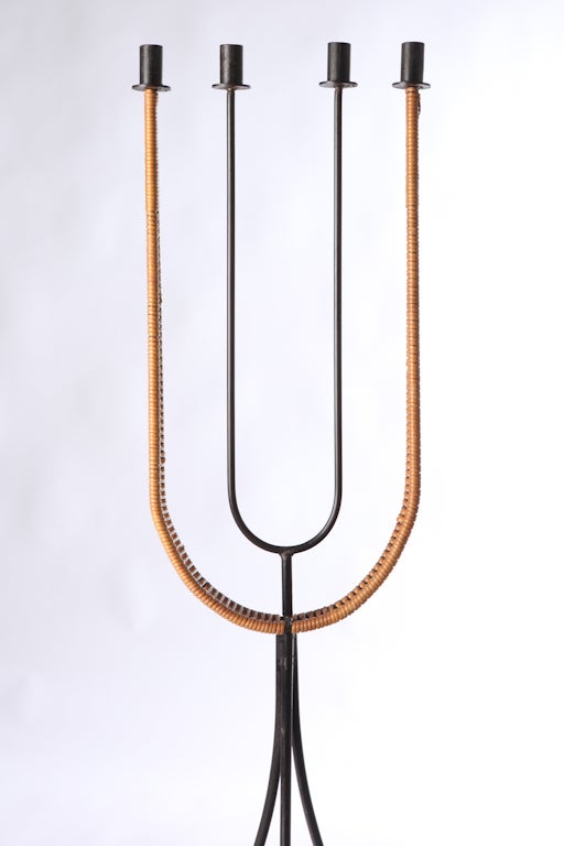 Wrought iron and woven rattan curved candelabrum designed by Arthur Umanoff, circa 1950.
