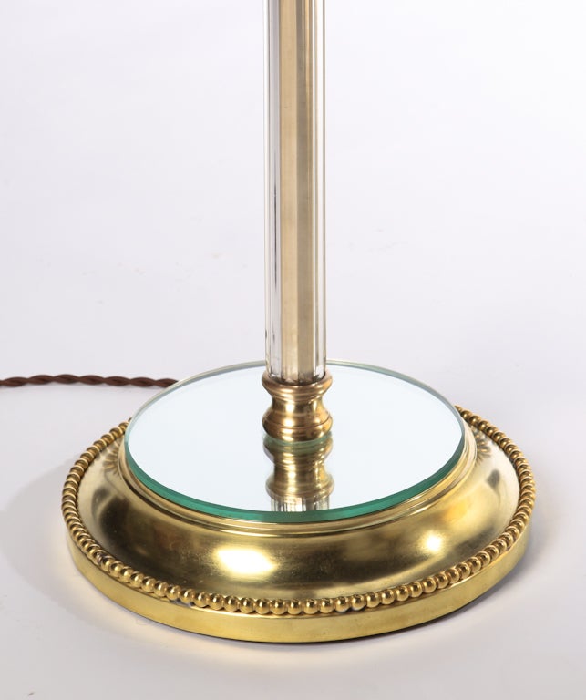 Chic dore bronze and crystal column floor lamp with bronze fittings and mirrored base. Original double socketed hardware has been rewired. By Mutual Sunset Lamp Company, 1940