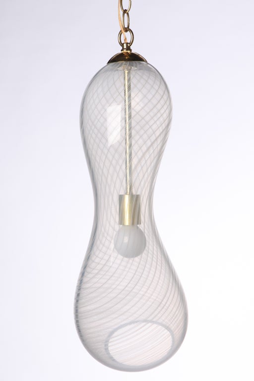 Beautiful organic form handblown ribbon glass hanging pendant chandelier with brass ceiling cap and chain.