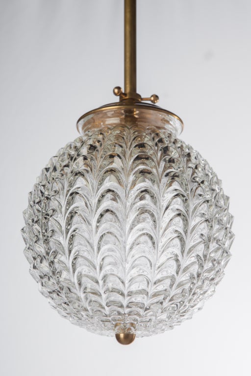 Round German textured glass wave pendant chandelier with brass cap, rod and fittings, circa 1960s. Brass rod may be customized for desired height.